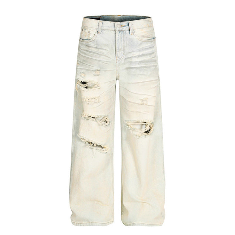 Dirty dyed ripped denim jeans washed with water
