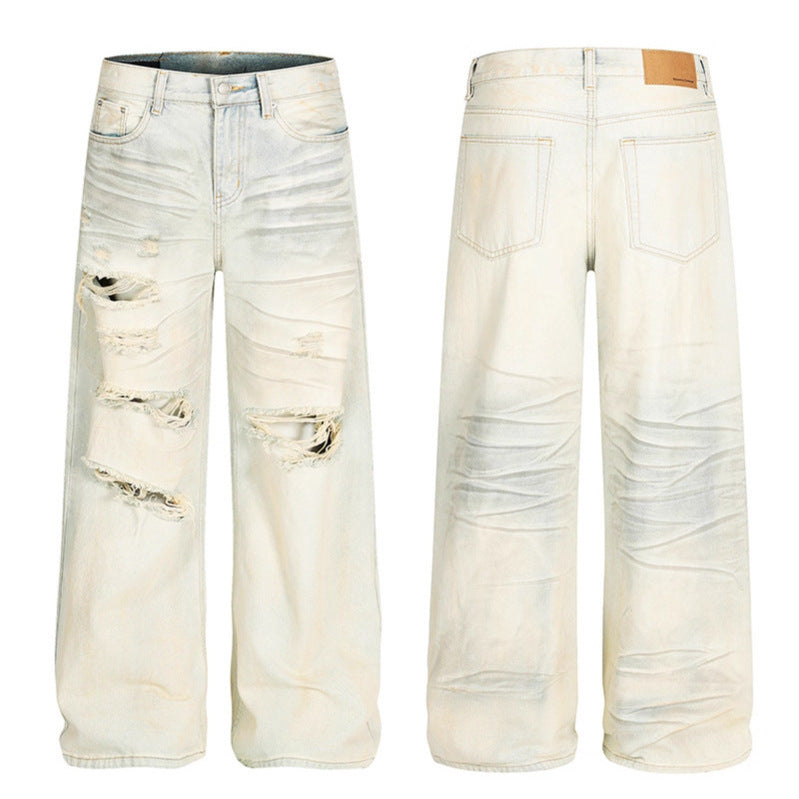 Dirty dyed ripped denim jeans washed with water