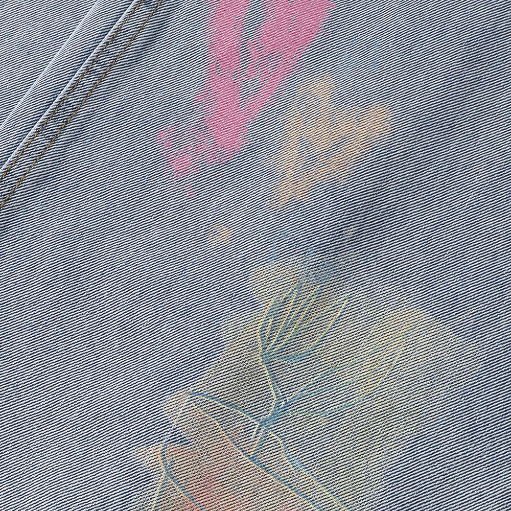 Graffiti printed washed denim jeans
