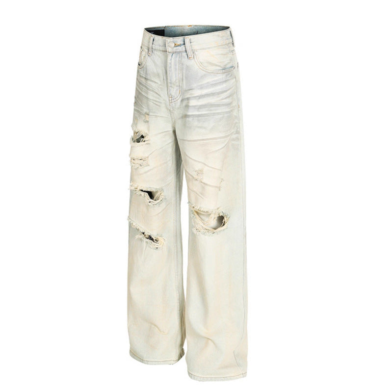 Dirty dyed ripped denim jeans washed with water