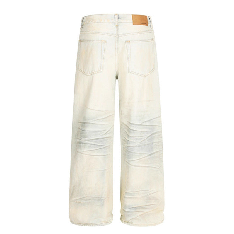 Dirty dyed ripped denim jeans washed with water