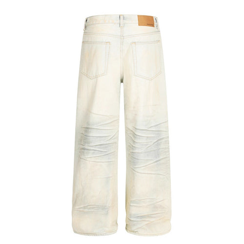Dirty dyed ripped denim jeans washed with water