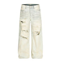 Dirty dyed ripped denim jeans washed with water