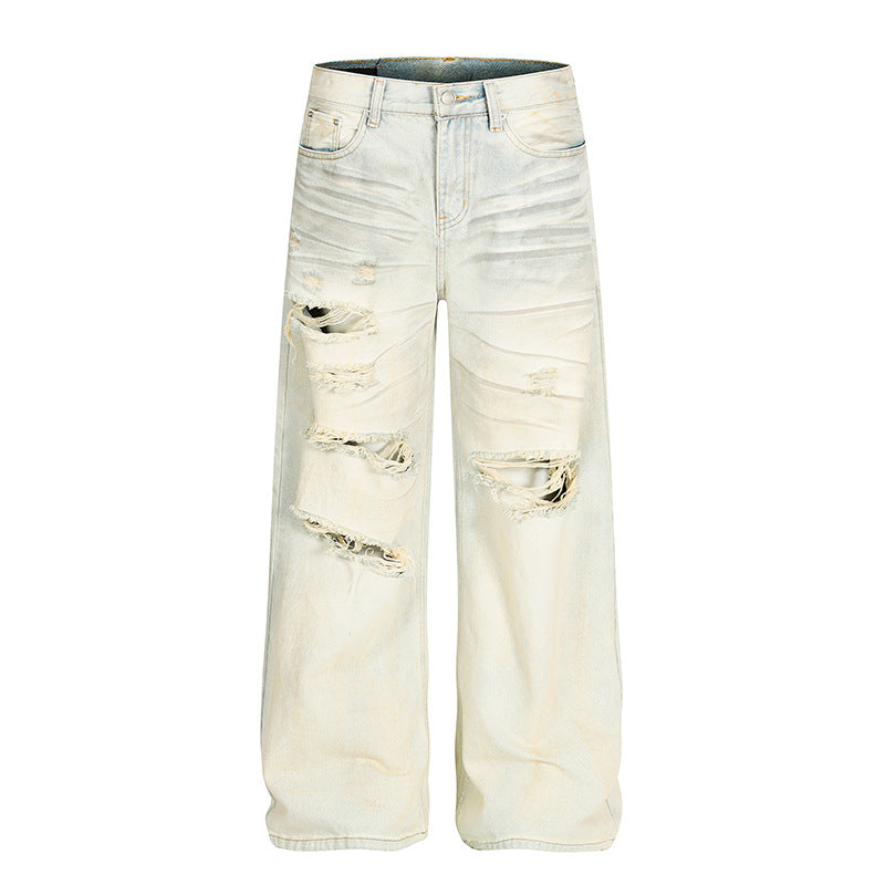 Dirty dyed ripped denim jeans washed with water